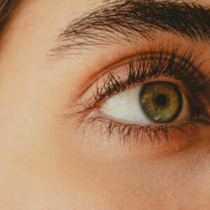 a close up of a person's eye with long lashes